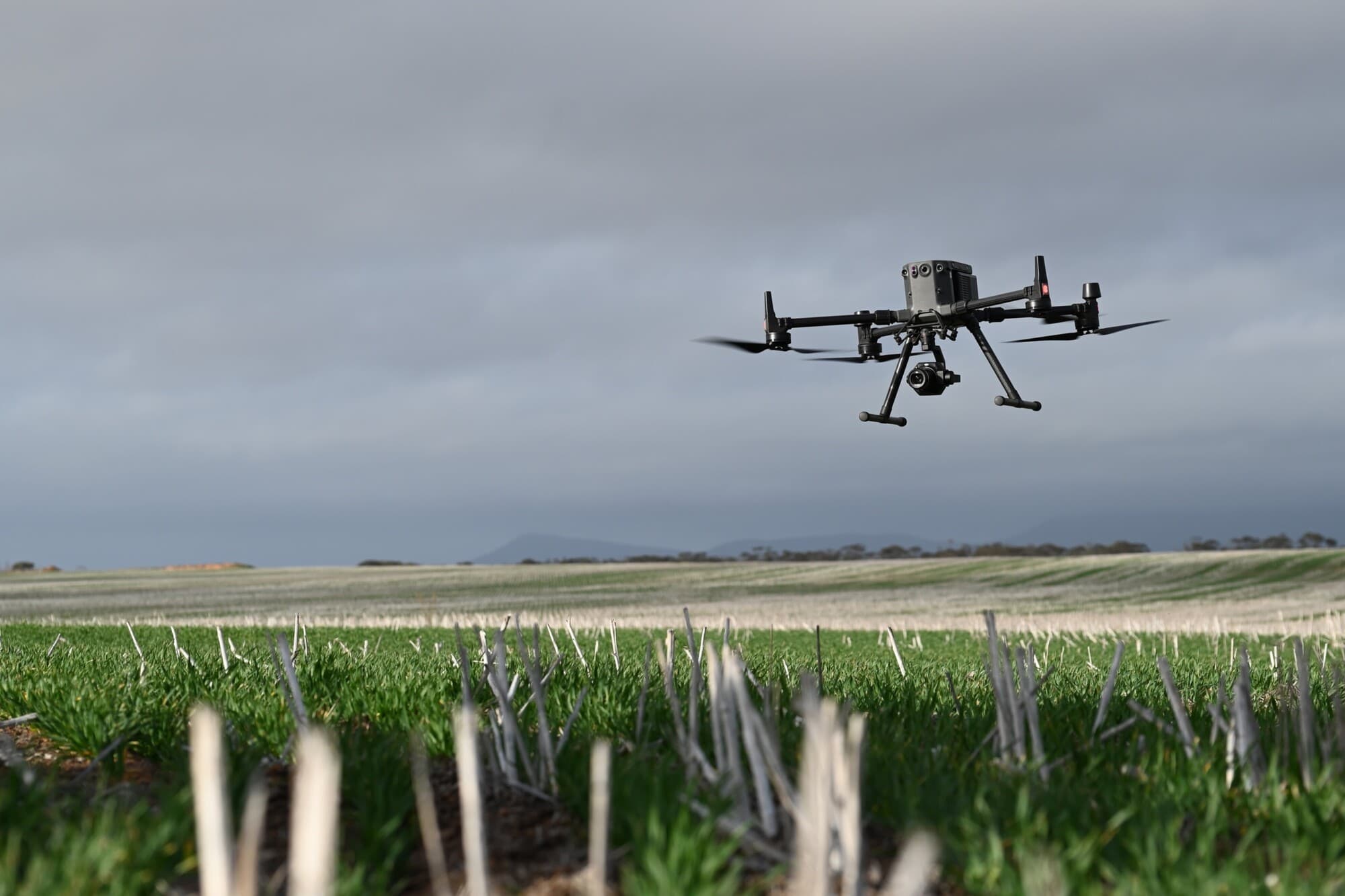 Drone flying over field